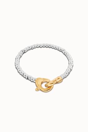 Pulsera de bolas pequeñas bañada en oro con mosqueton entrelazado en oro Unode50